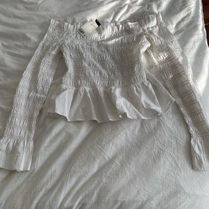 White ruffle off the shoulder top